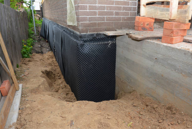 SJ Waterproofing Pros technician performing targeted Emergency Waterproofing assessment in Woodmere, NY